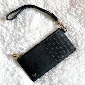 Tory Burch black card holder with cash pocket.